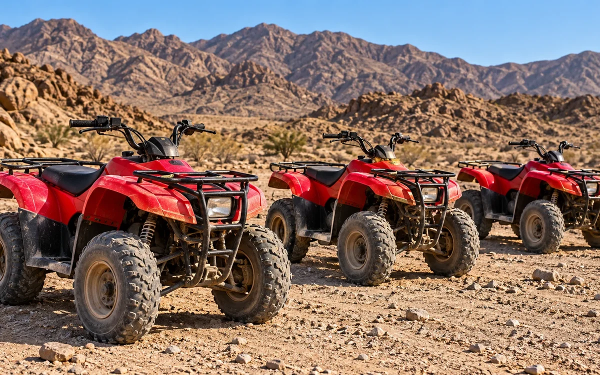 Illustration: Three parked quads on rocky desert ground
