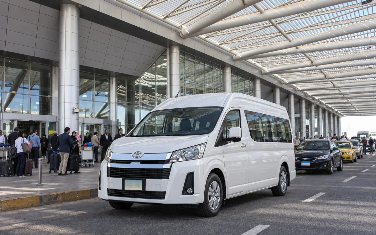 White van outside an airport terminal