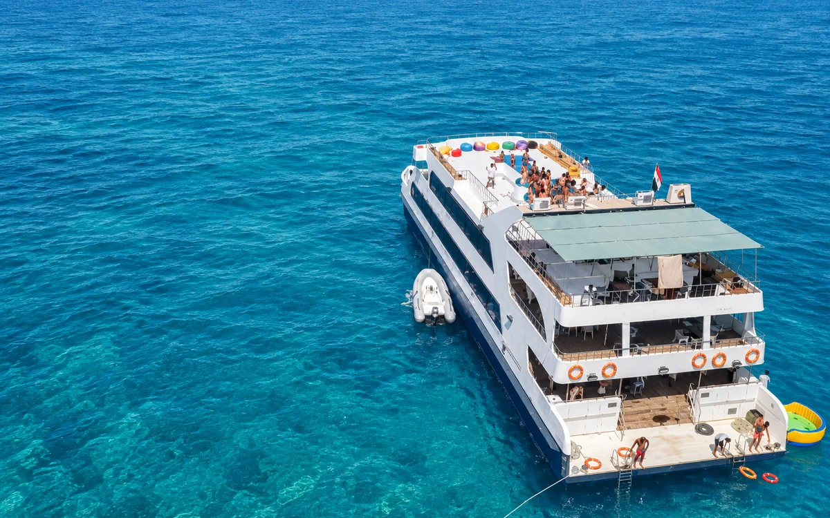 Party catamaran seen from above on the Red Sea near Hurghada Party catamaran seen from above on the Red Sea near Hurghada