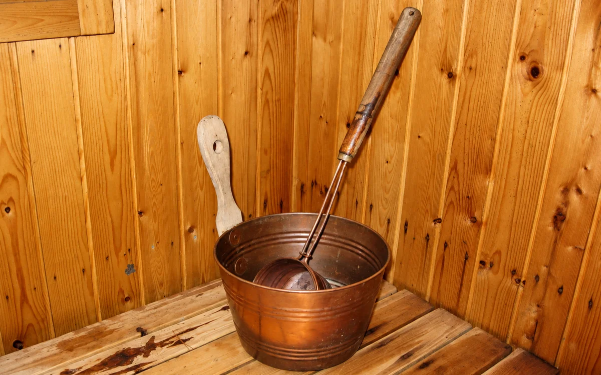 Representative image: copper bucket and ladles in a wooden sauna